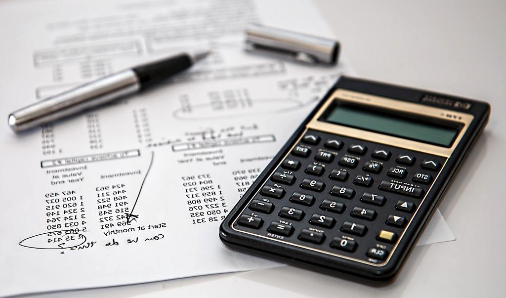 Person using a calculator on a desk