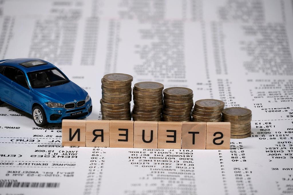 Debt reduction concept with coins and calculator